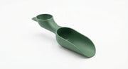 Mini Soil Scoop and Funnel Set for Indoor Potting shown in use with an indoor plant setup